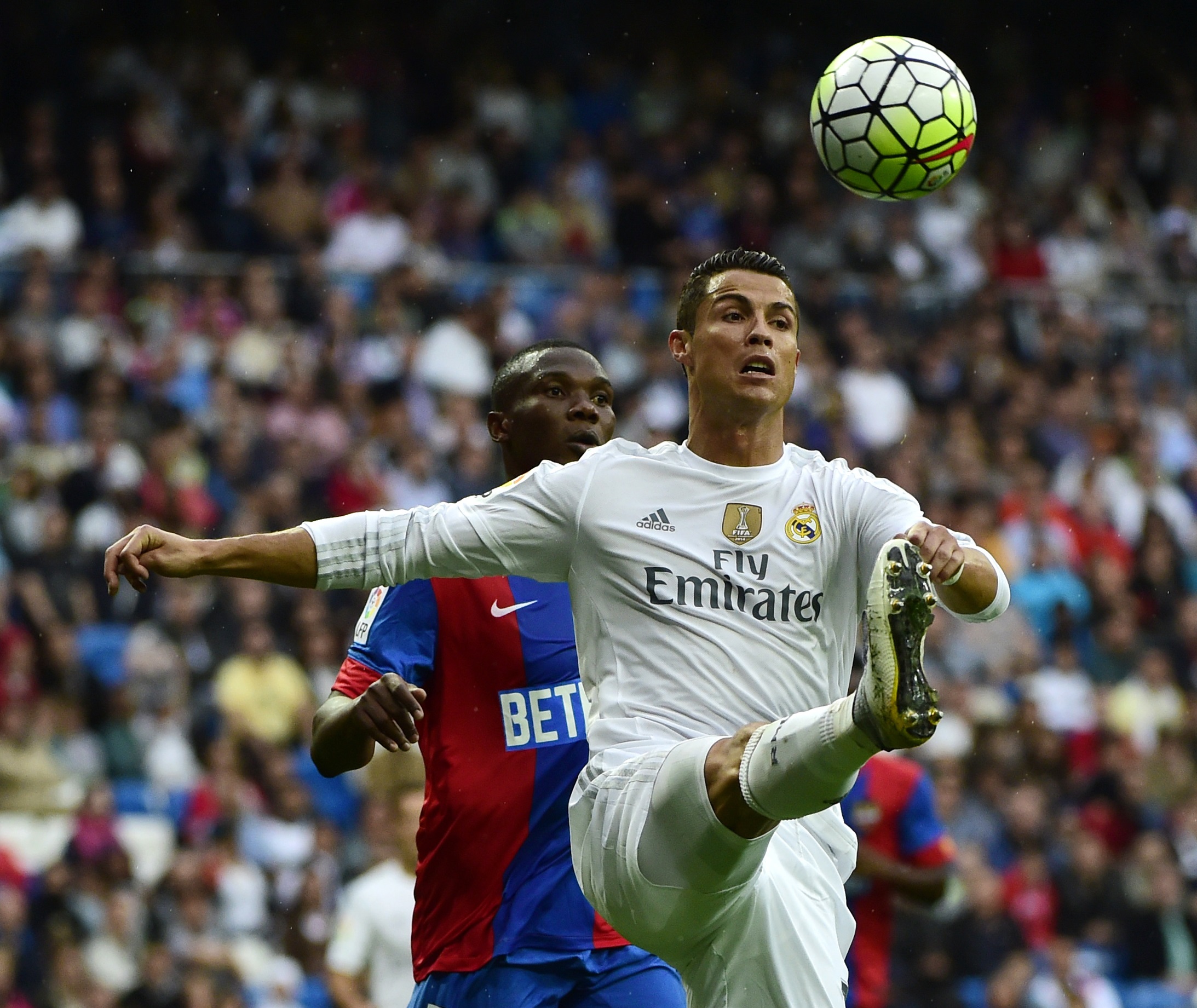 Real Madrid's Portuguese forward Cristiano Ronaldo (R) vies with Levante's Mozambican midfielder Simao during the Spanish league football match Real Madrid CF vs Levante UD at the Santiago Bernabeu stadium in Madrid on October 17, 2015. AFP PHOTO/ PIERRE-PHILIPPE MARCOU